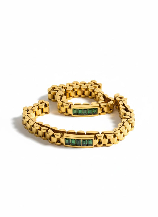 سوار معدني ذهبي بأحجار خضراء